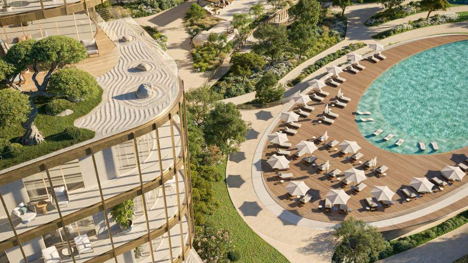 Aerial view of a modern luxury resort with curved architecture, lush greenery, a large swimming pool, and numerous sun loungers around it.