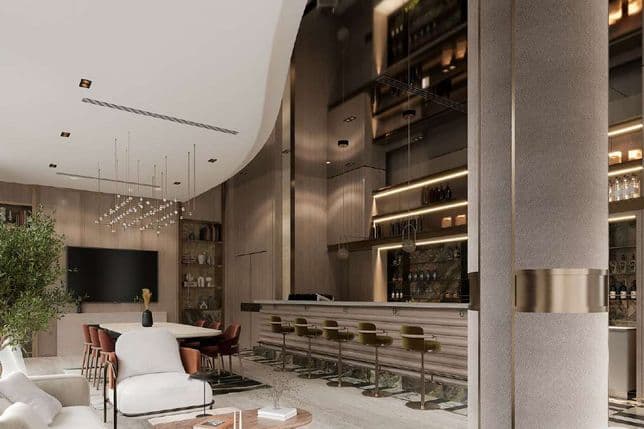 Spacious modern living area with elegant furniture, high ceiling, stylish chandelier, and a sleek bar with stools, creating a luxurious ambiance.