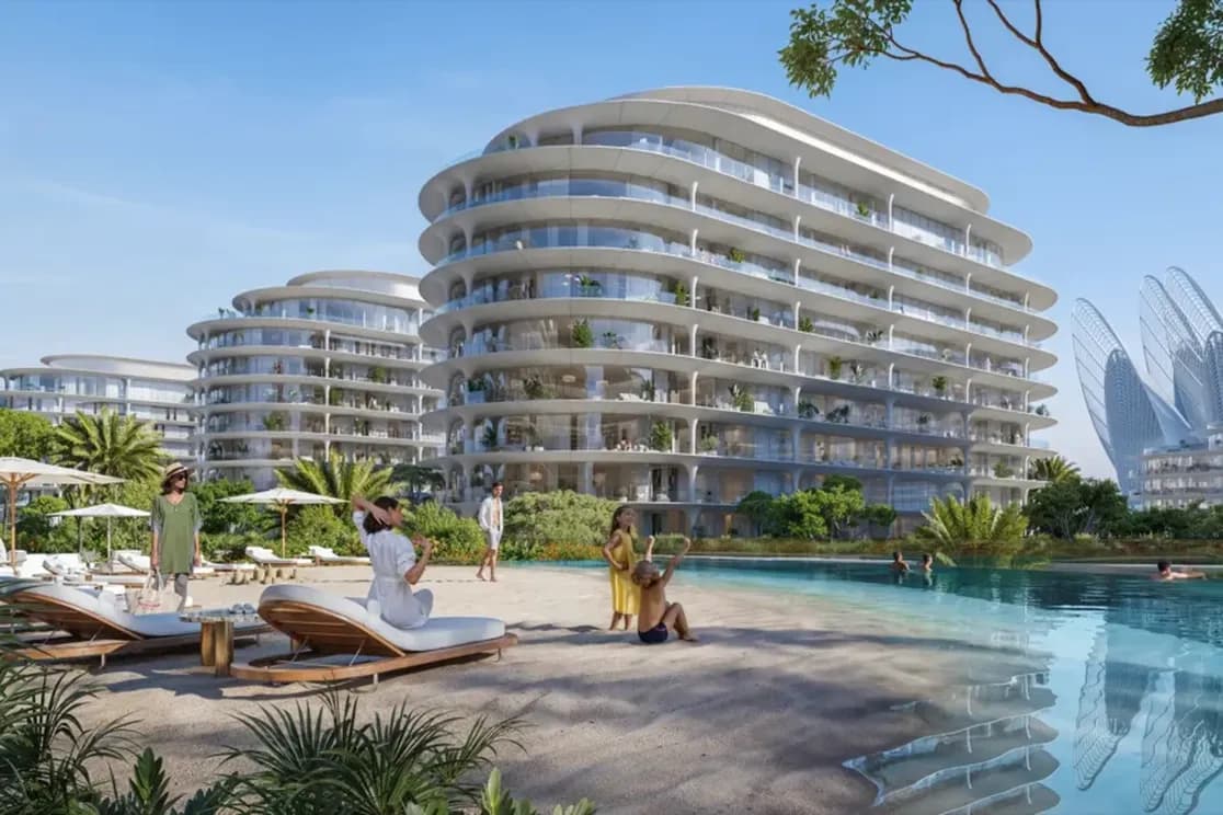 Luxurious beachfront resort with modern, curved buildings, a pool, palm trees, and loungers. People relax under umbrellas. Futuristic buildings nearby.