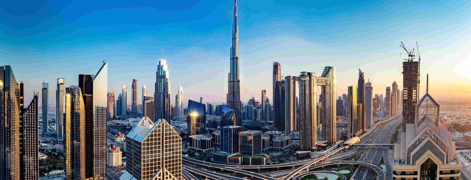 The Downtown Dubai skyline at dusk, symbolizing the city's dynamic real estate market and the importance of understanding current mortgage interest rates.