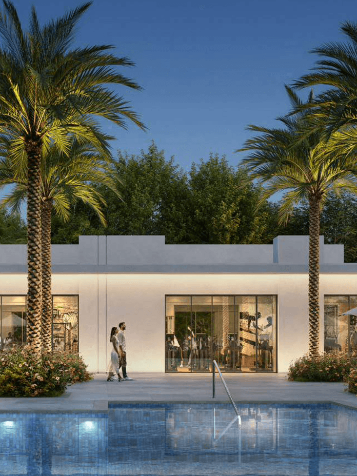 Outdoor pool area at Vindera at The Valley featuring landscaped seating zones, shaded areas, greenery, and family friendly spaces designed for daily leisure.