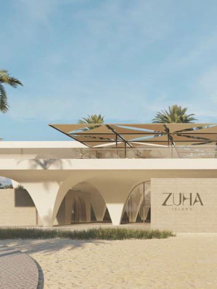 Modern white building with arched design, large windows, and a sign reading "ZUHA Island." Surrounded by palm trees under a clear blue sky.