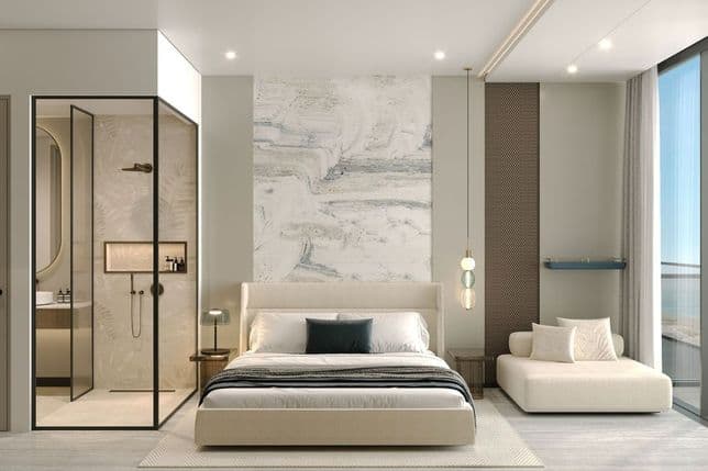 Contemporary bedroom with glass partition to bathroom