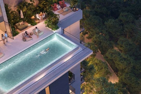 Dachterrasse mit Infinity-Pool und Gartenbereich in Distrikt mit Blick auf das Blätterdach des Waldes in Ghaf Woods.