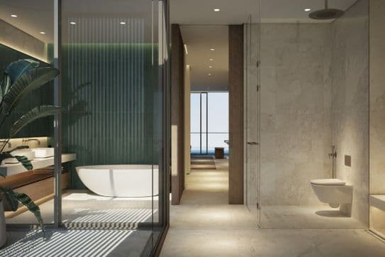 Modern bathroom with large green tiles, bathtub, walk-in shower, and distant view of the ocean.