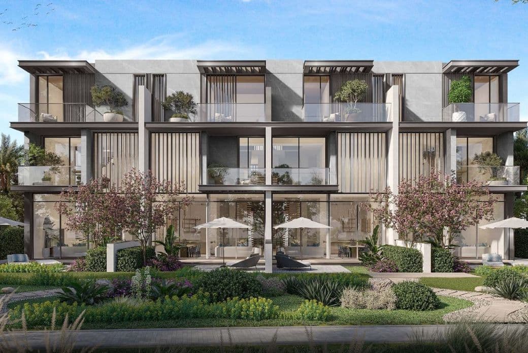 Exterior view of a 7-bedroom villa at Nad Al Sheba Gardens Phase 10 by Meraas, showcasing modern design, full-height glass panels, and a private pool.