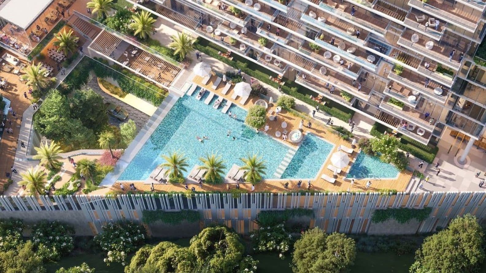 Luftaufnahme des Dachpools mit Sonnenliegen, Sonnenschirmen und angelegten Terrassen.