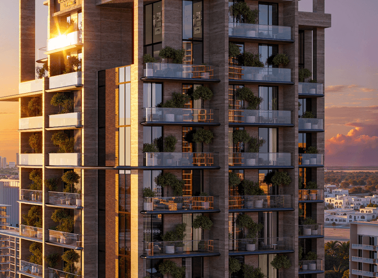 Exterior view of Coventry Living in Jumeirah Village Circle, showing the modern façade, glass balconies and landscaped terraces.