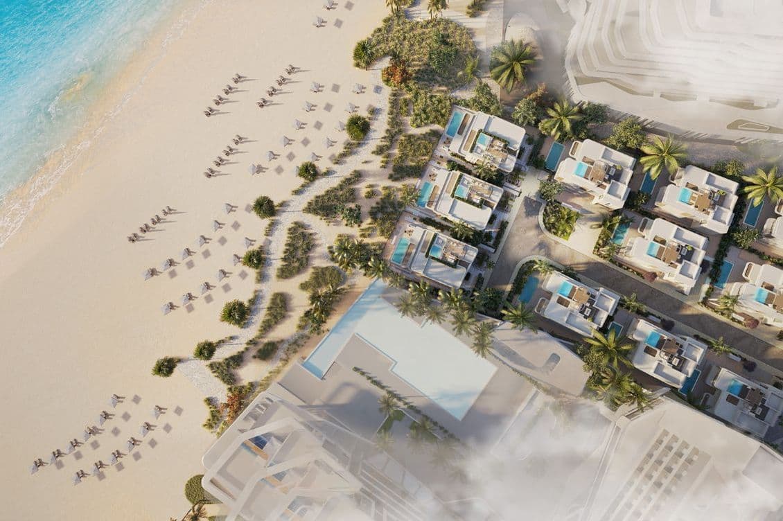 Aerial view of Dubai Islands showing residential towers, beach villas, and coastline amenities.