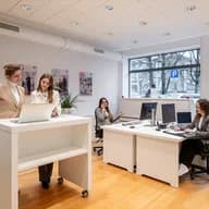 Real estate consultants at Engel & Völkers Winterthur advise clients in a modern, open office.