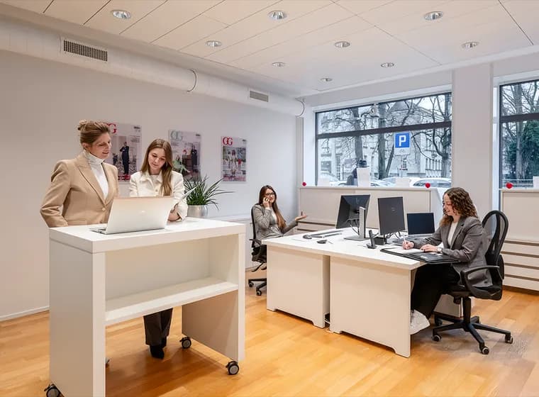 Real estate consultants at Engel & Völkers Winterthur advise clients in a modern, open office.