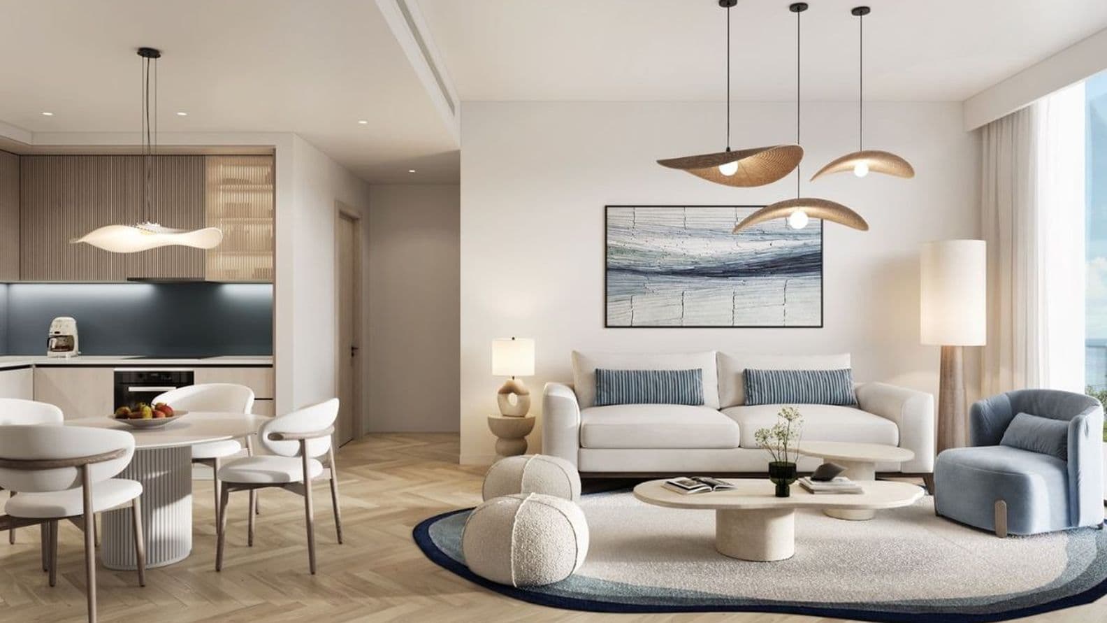 Modern living and dining room with coastal-inspired interiors at Nikki Beach Residences by Aldar in RAK, overlooking the sea.
