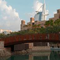 traditional architecture with contemporary Burj Al Arab in the background