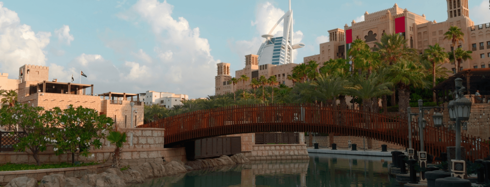 traditional architecture with contemporary Burj Al Arab in the background