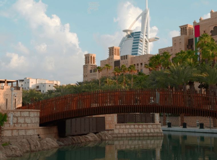 traditional architecture with contemporary Burj Al Arab in the background