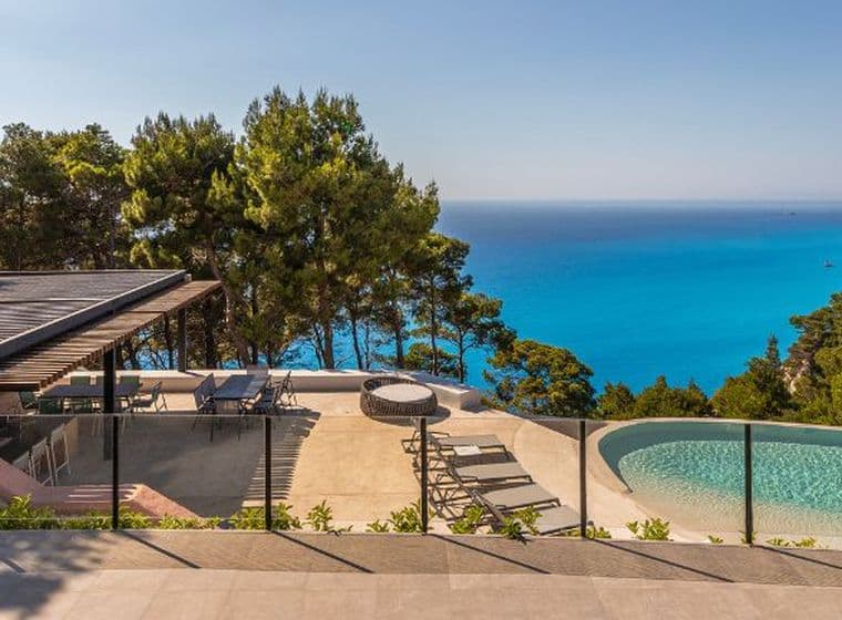 Luxury seaside villa with infinity pool, panoramic sea views, and lush natural surroundings