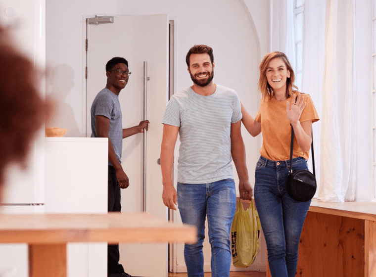 Tenants in Dubai viewing a rental property, highlighting the importance of understanding Dubai's rental and tenancy laws.