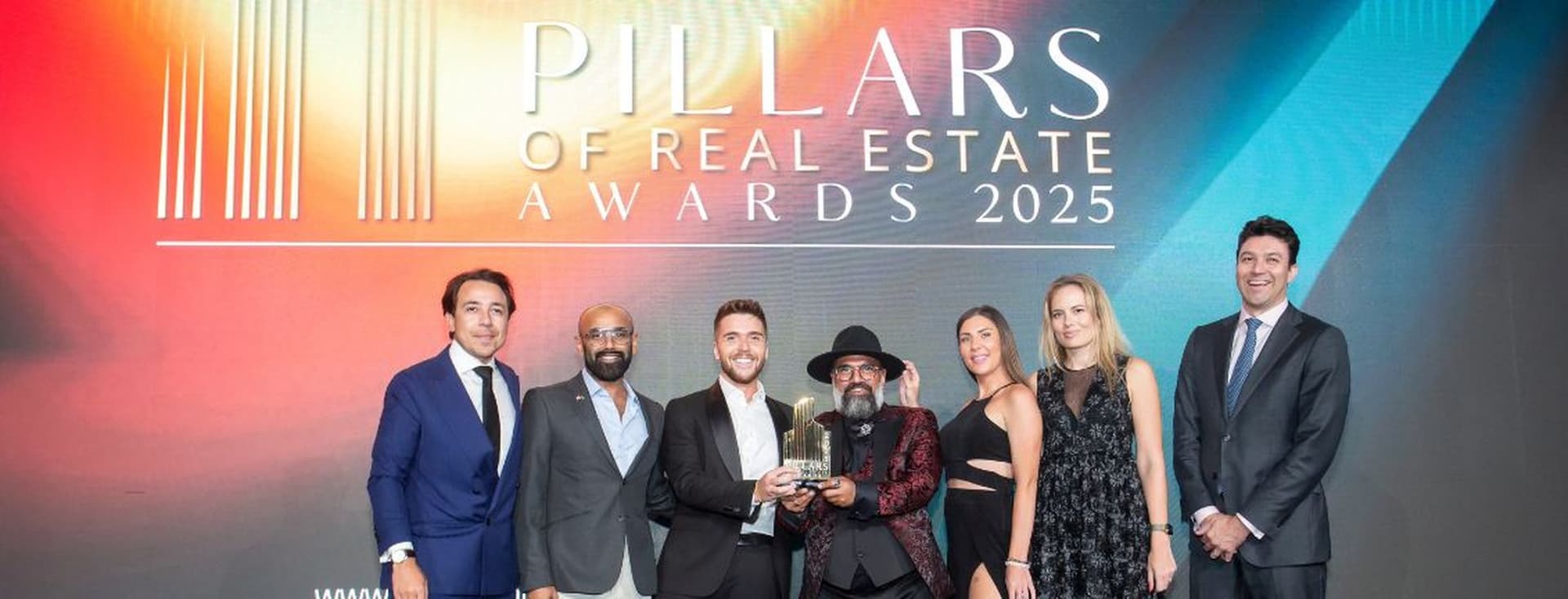 Engel & Volkers Dubai Team receiving the Real Estate Agency Of The Year award at the Pillars Of Real Estate Awards