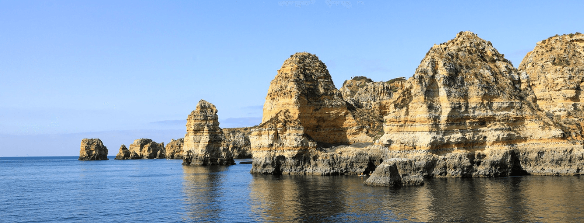 View of the Costa de Oiro with its rocky shores and tranquil waters
