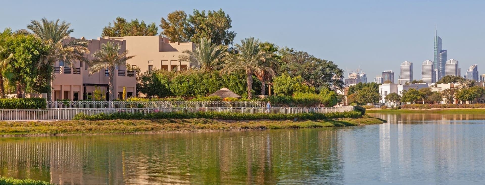 Lake and villas in Emirates Living, one of the top areas for British expats in Dubai