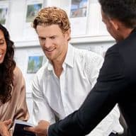 Couple receives consultation for buy-to-let mortgage from mortgage advisor