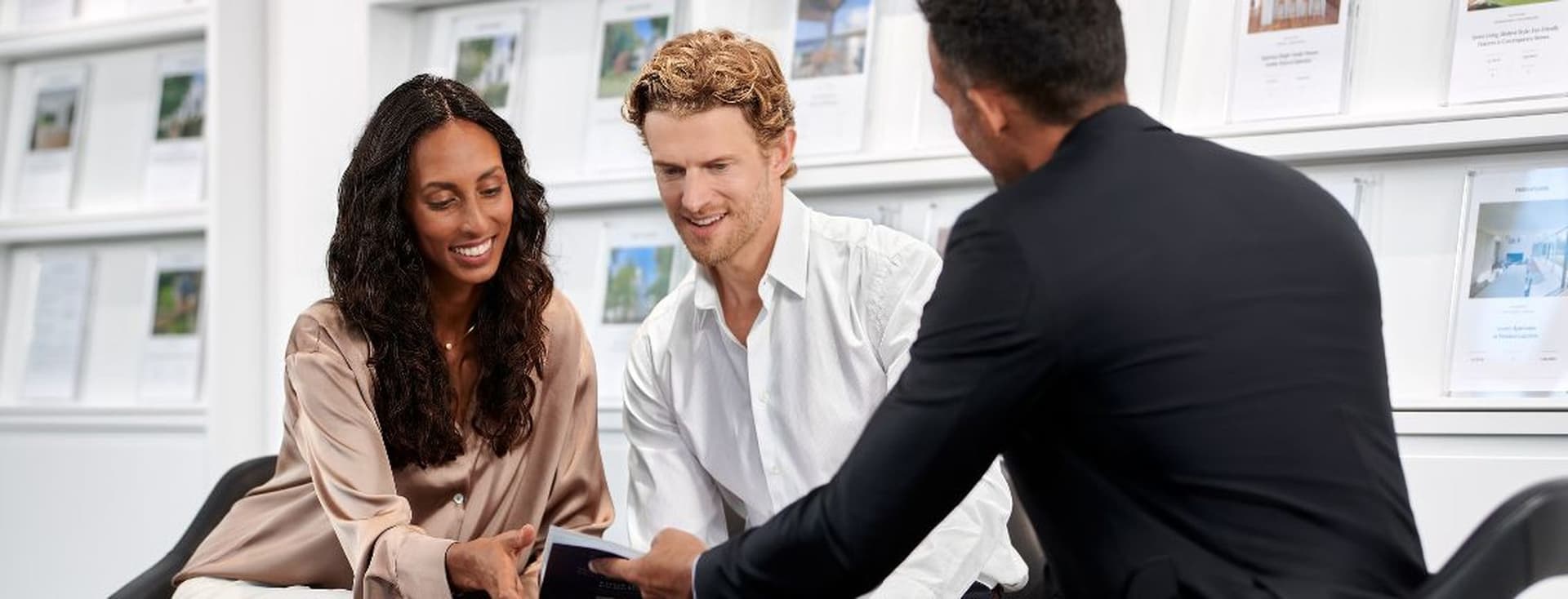 Couple receives consultation for buy-to-let mortgage from mortgage advisor