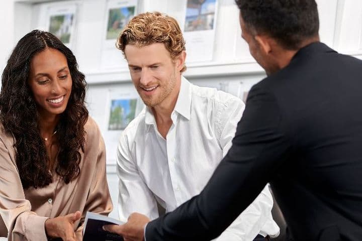 Couple receives consultation for buy-to-let mortgage from mortgage advisor