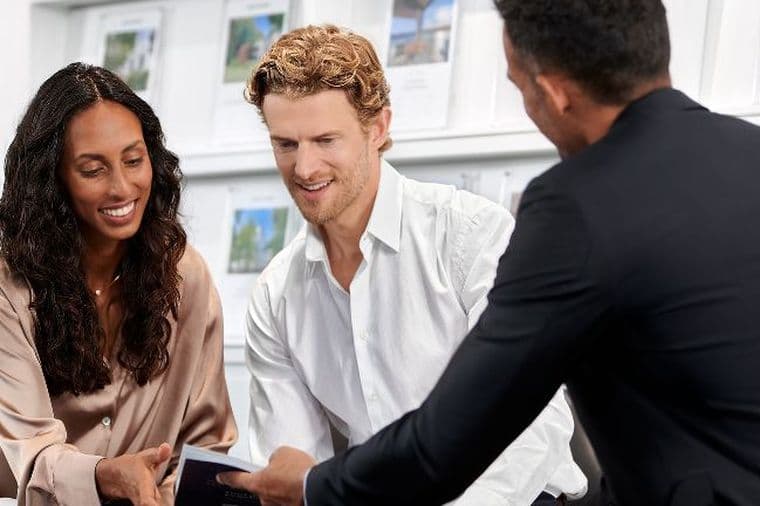 Couple receives consultation for buy-to-let mortgage from mortgage advisor