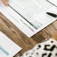 Person reviews paperwork regarding credit card application and security cheque