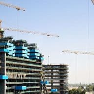 Contemporary apartments under construction in a prime Business Bay location, showcasing the appeal of buying off-plan property in Dubai.