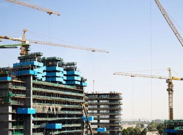 Contemporary apartments under construction in a prime Business Bay location, showcasing the appeal of buying off-plan property in Dubai.