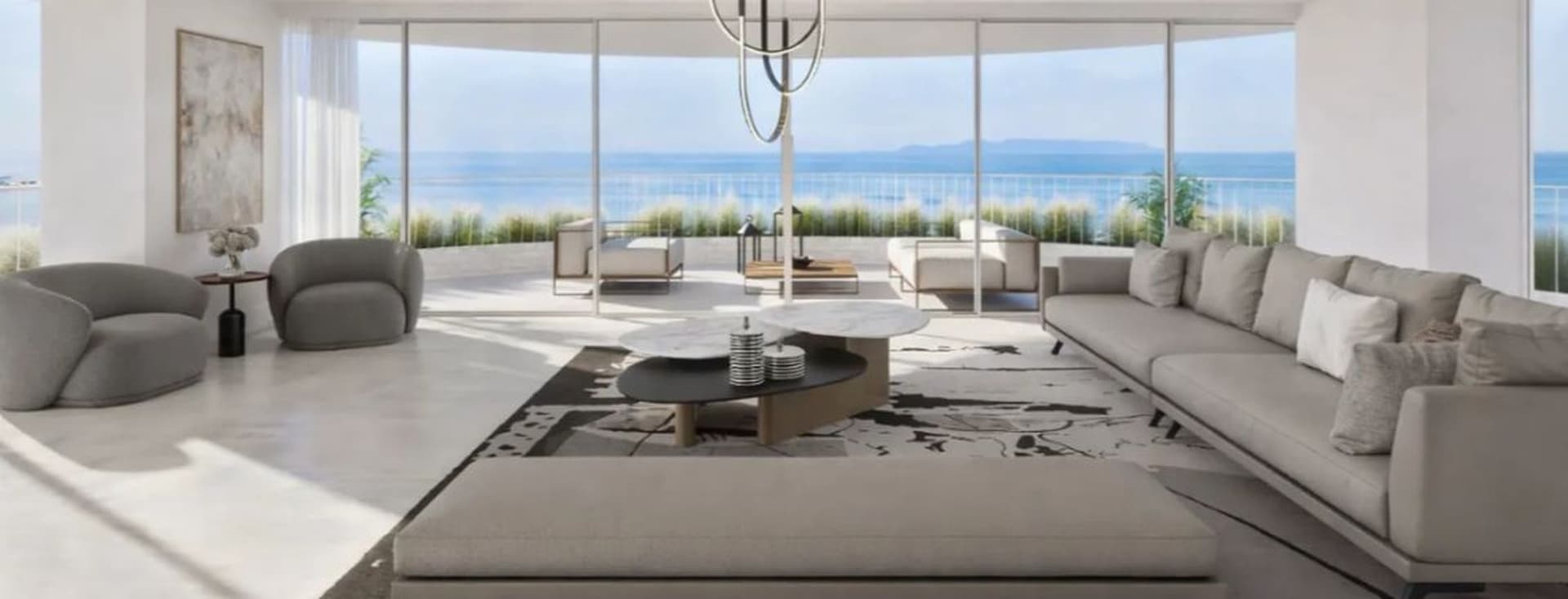 Luxury living room with panoramic sea views, minimalist design, and large glass windows