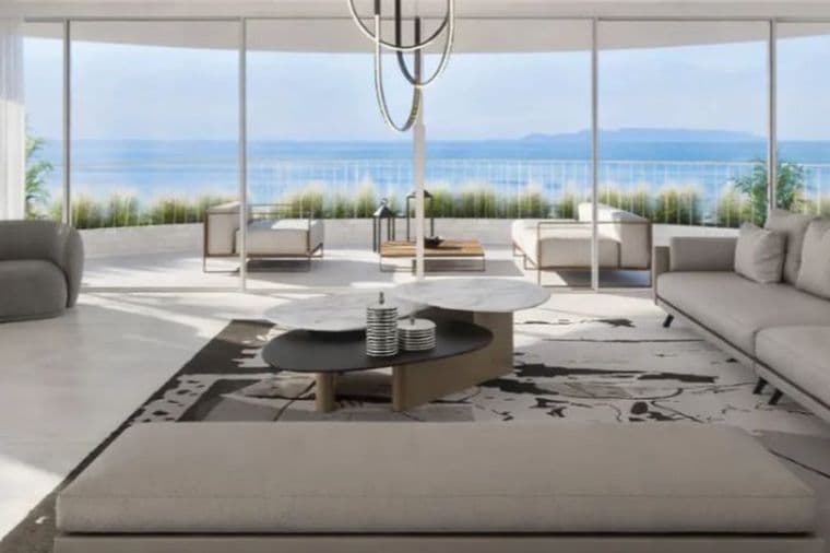Luxury living room with panoramic sea views, minimalist design, and large glass windows