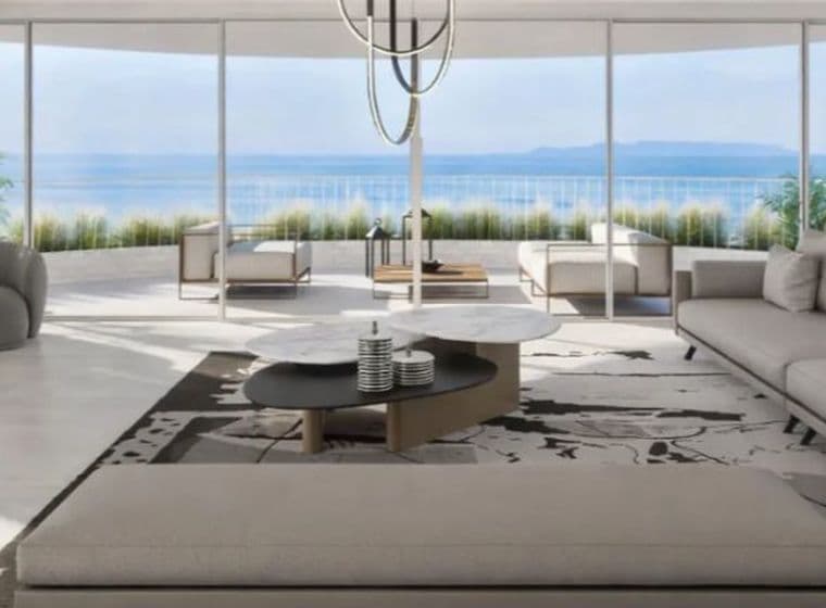 Luxury living room with panoramic sea views, minimalist design, and large glass windows