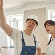 Home inspector with new homeowner points to issue whilst creating a snag list at a new property