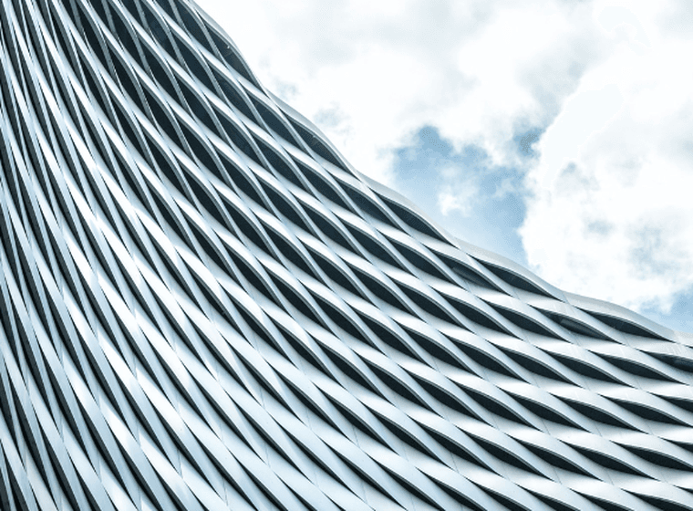 The facade of a sleek contemporary commercial building, highlighting key considerations for investors comparing commercial and residential real estate.