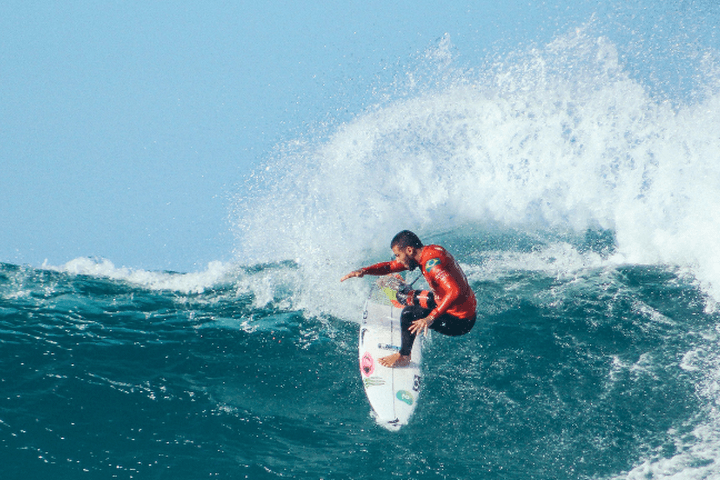 A surfer riding a wave