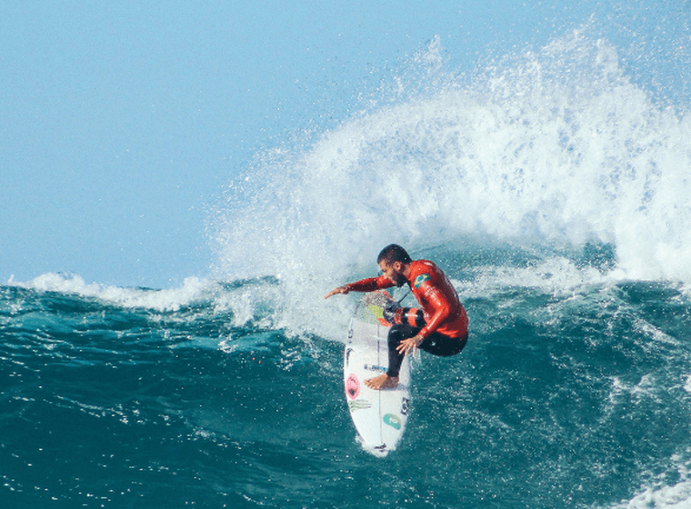 A surfer riding a wave