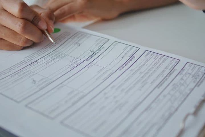 person reads over RERA forms before signing