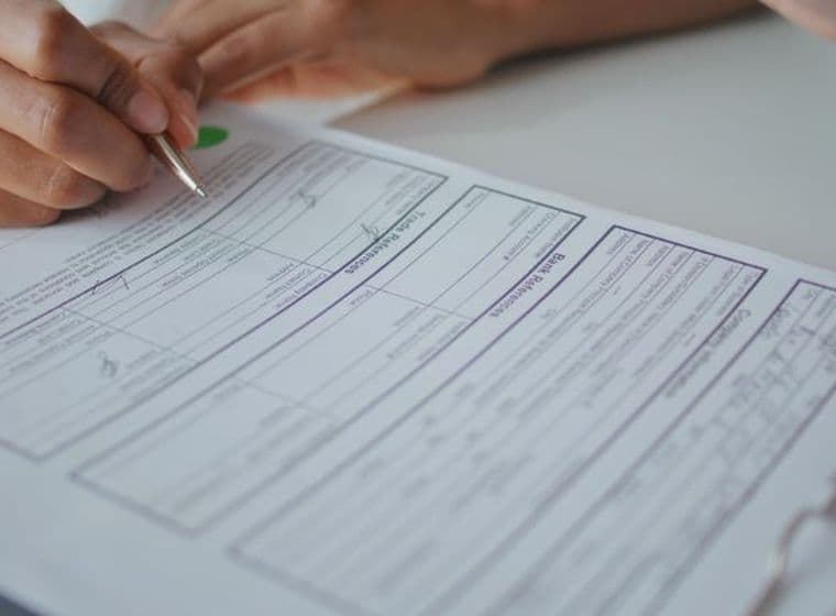 person reads over RERA forms before signing