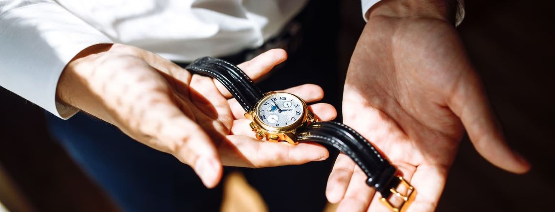 Man holding a watch