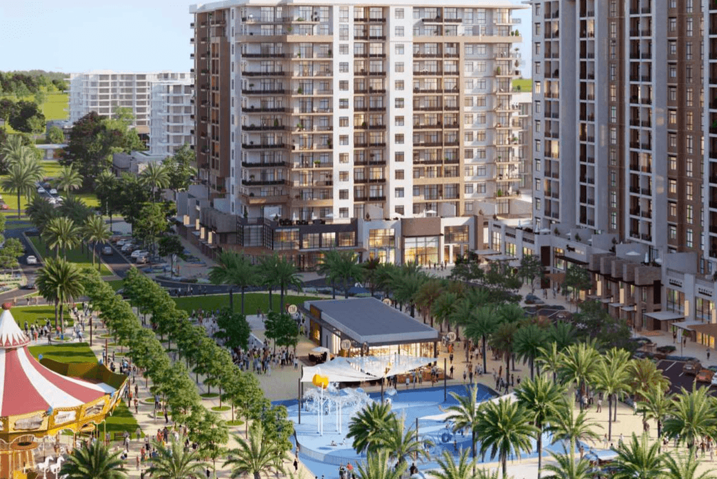 Community plaza at Odessa showing residential buildings, landscaped walkways, palm lined outdoor areas, and family friendly leisure spaces.