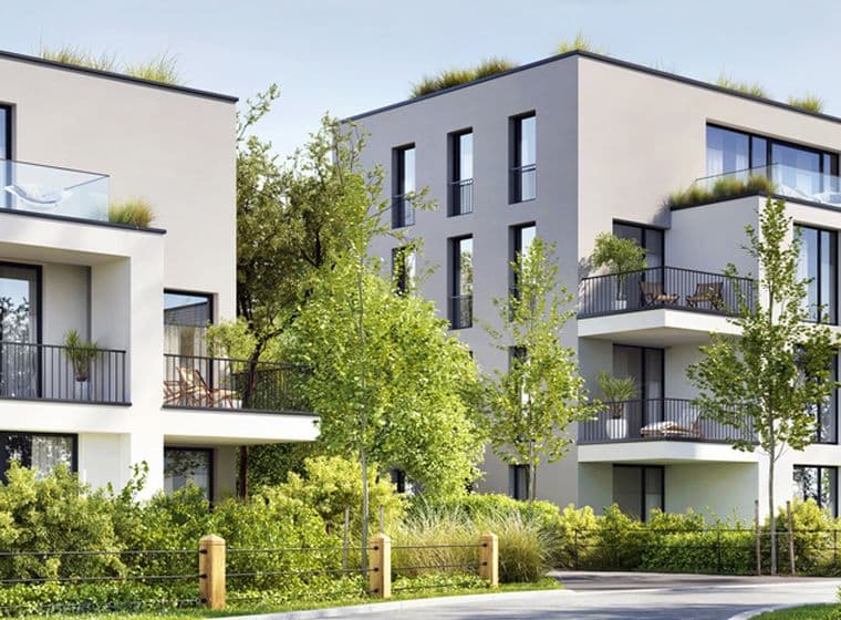 Modernes Mehrfamilienhaus von aussen mit Garten