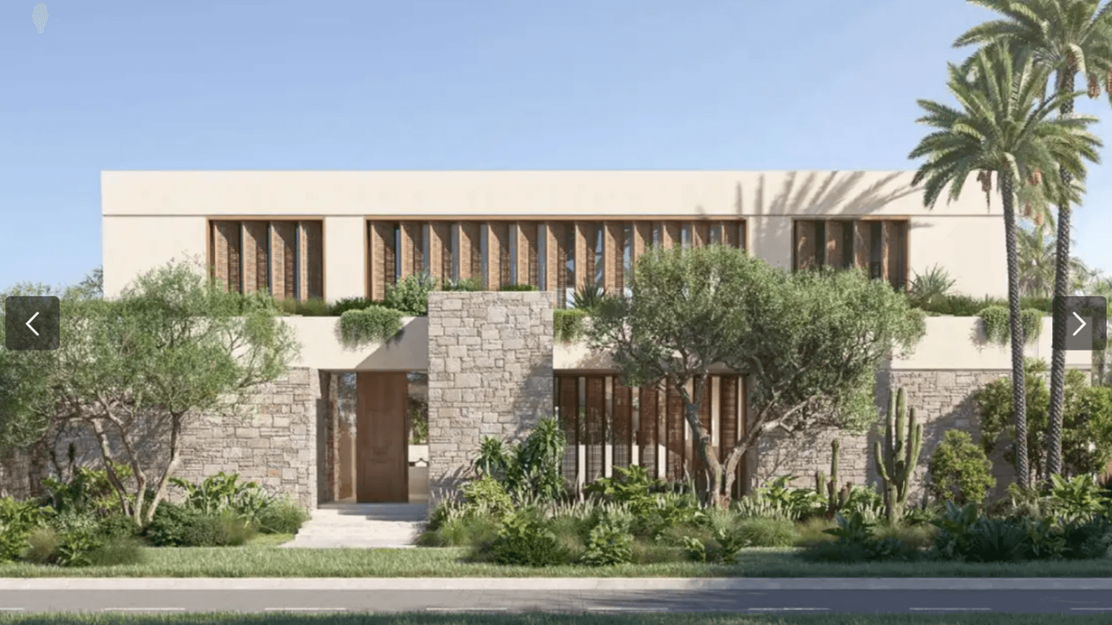 Modern two-story house with stone and beige facade, surrounded by lush greenery, palm trees, and a clear blue sky.