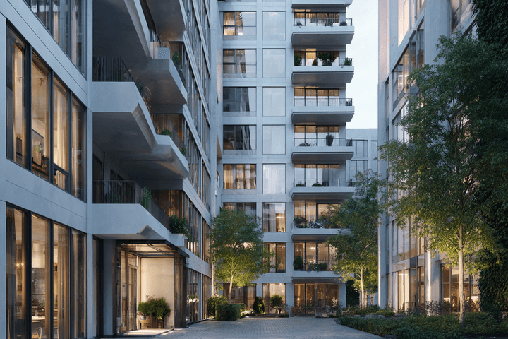 Modern apartment complex with large glass windows, balconies, and greenery. Courtyard area with paved paths and ambient evening lighting.