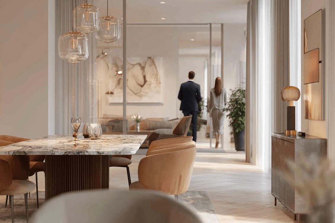 A man and a woman, shown from the back, in a luxurious spacious living room.