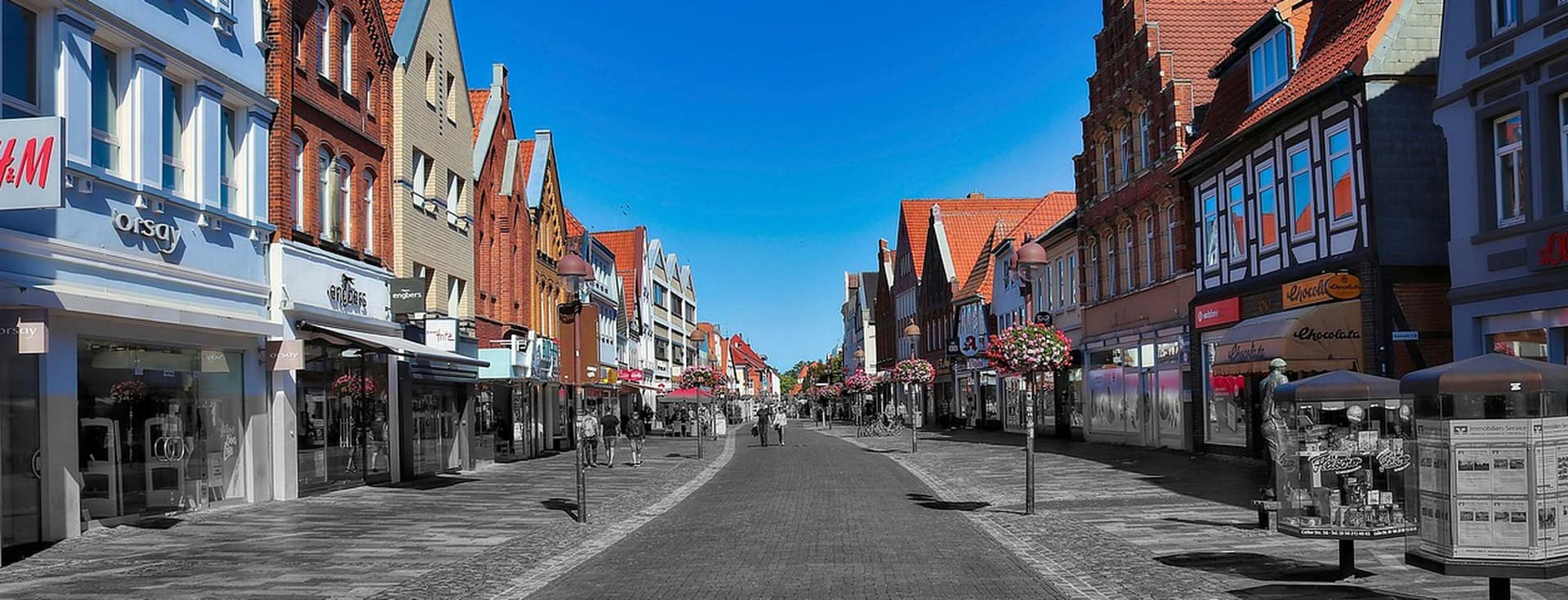 View into a pedestrian zone with residential and commercial buildings