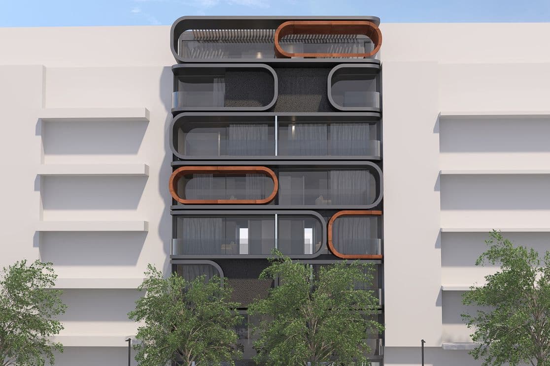 Contemporary multi-story building with stacked rounded-rectangle balconies framed in black and wood, street trees and parked cars in front.