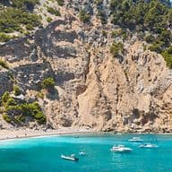 Bay with boats and cliffs