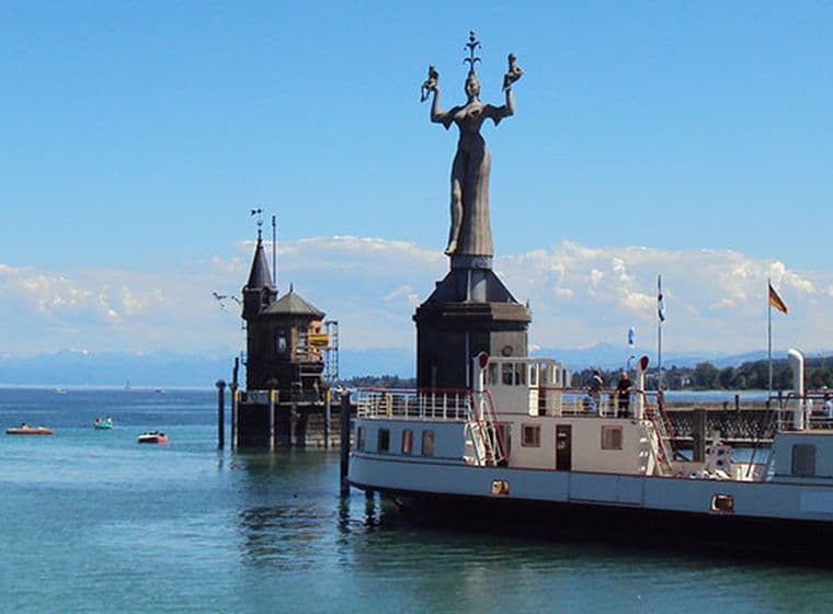 Imperia statue at Konstanz harbor overlooking Lake Constance and the Alps – iconic lakeside landmark